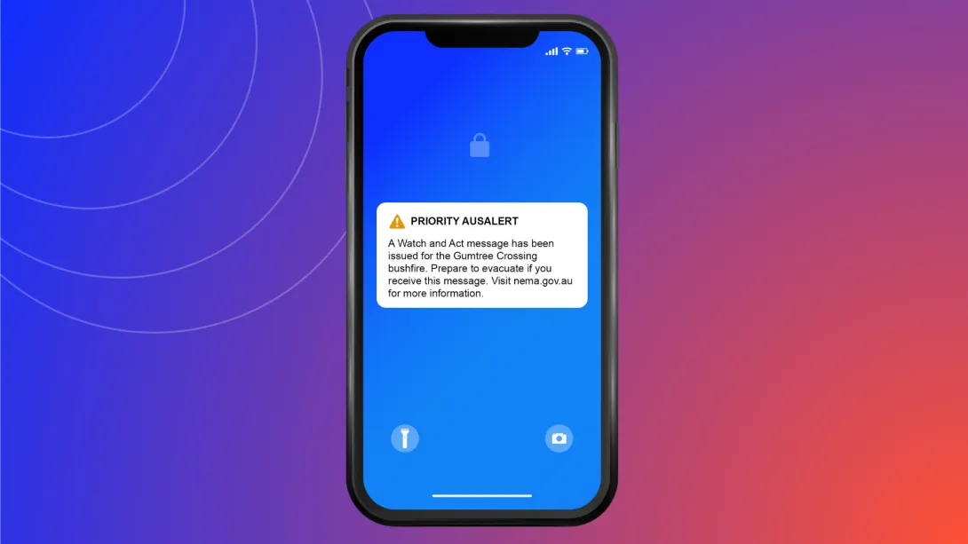Mockup of a phone with message: PRIORITY AUSALERT. A Watch and Act message has been issued for the Gumtree Crossing bushfire. Prepare to evacuate if you receive this message. Visit nema.gov.au for more information.